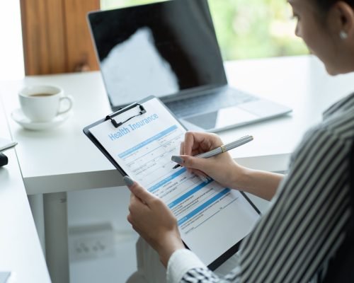 Health Insurance Assurance Medical Risk Safety Concept, Asian woman studying health insurance inform